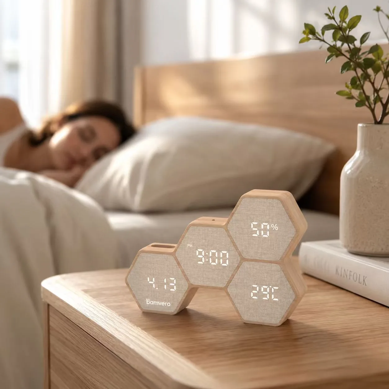 G268 bamboo fabric clock with pen holder on a bedside table
